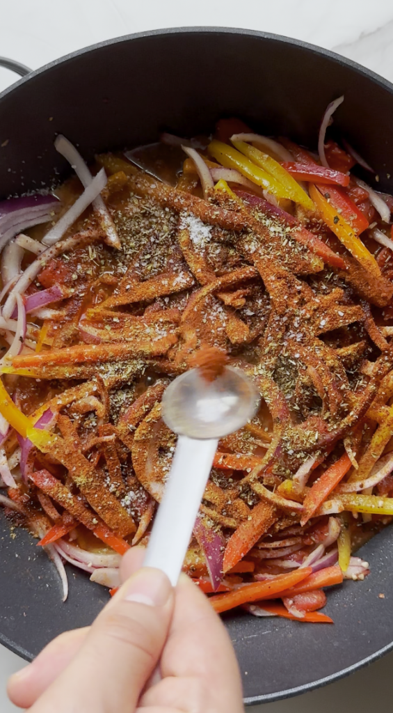 seasonings going into the chicken fajita pasta